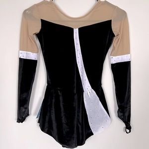 NWT BLACK VELVET FIGURE SKATING DRESS. Long sleeve. Pull on. Girls Size 10-12.